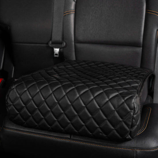 BoostedSafe Basic with leather cover installed in vehicle rear seat