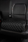 BoostedSafe Basic with leather cover installed in vehicle rear seat