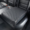 Refurbished BoostedSafe Elite disguised as a black quilted booster seat cover installed on a rear vehicle seat.