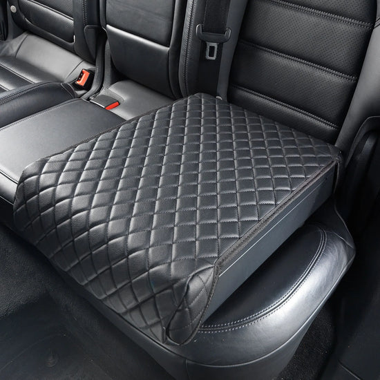 Boosted Safe Elite discreet vehicle safe disguised as a quilted leather booster seat in rear car seat.