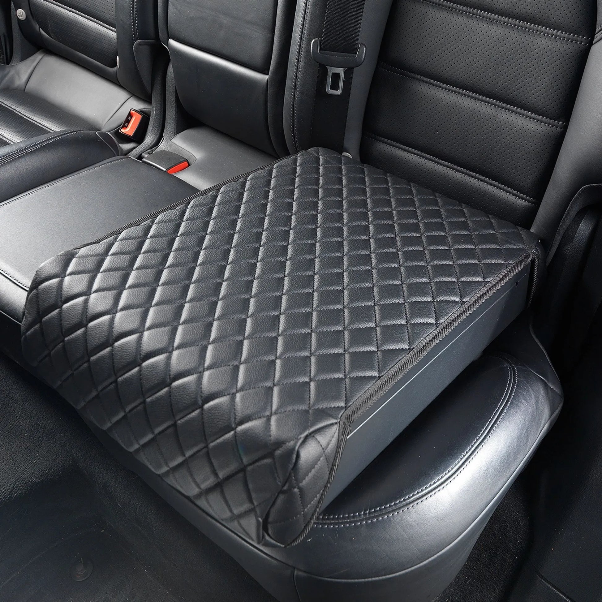 Boosted Safe Elite discreet vehicle safe disguised as a quilted leather booster seat in rear car seat.