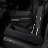 BoostedSafe Elite open hidden car safe with steel construction and gas strut lid supports installed in vehicle rear seat.