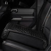 Boosted Safe Elite hidden vehicle safe with black quilted leather cover installed on rear car seat.