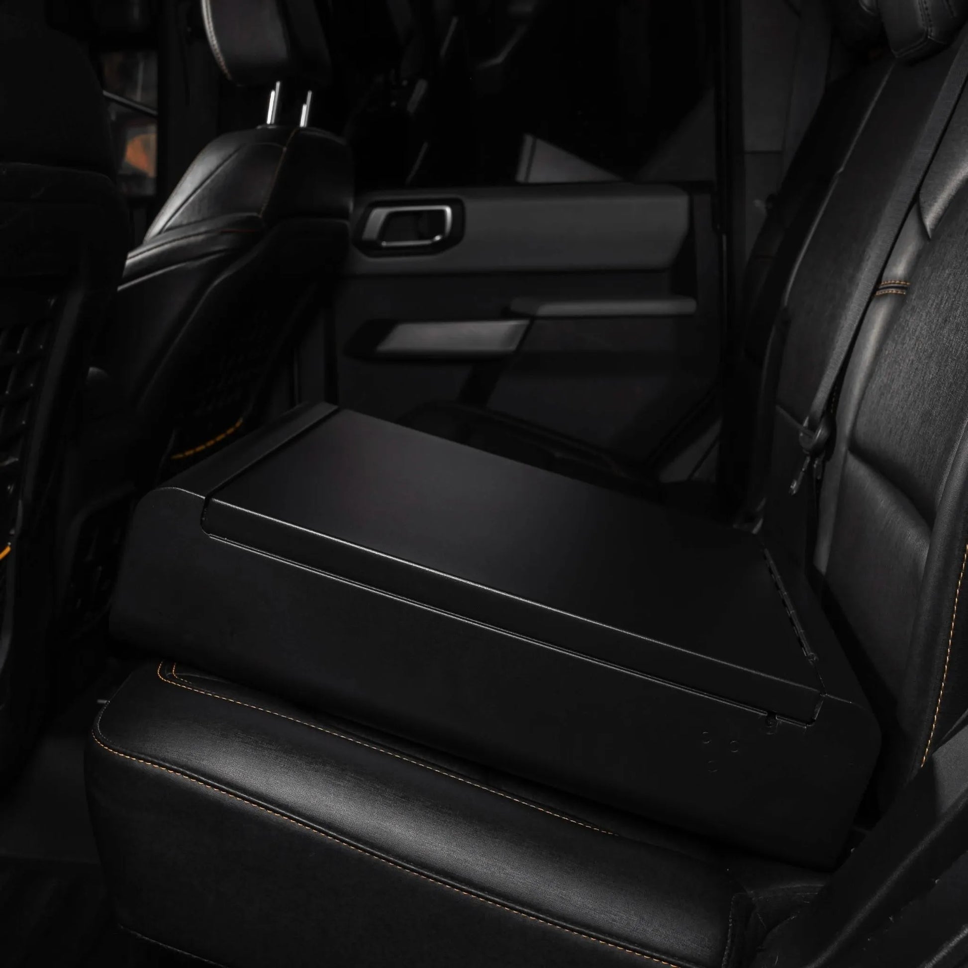 BoostedSafe Elite installed on a rear vehicle seat without the quilted booster seat disguise cover.