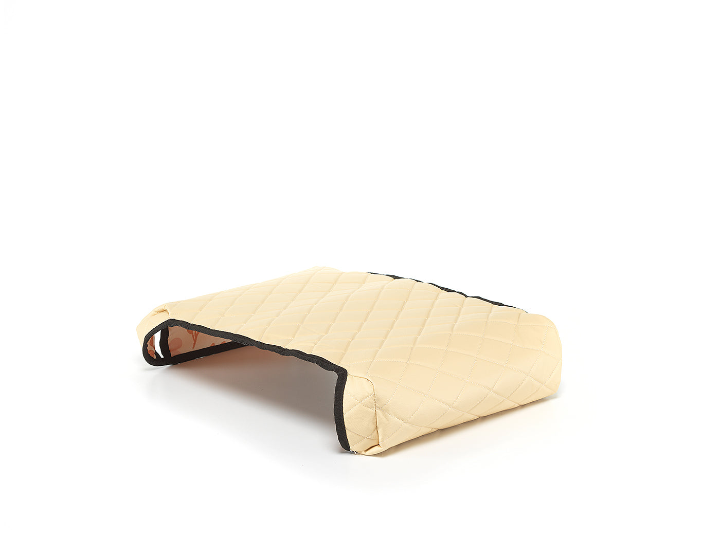 Beige reversible BoostedSafe cover showing quilted exterior and floral print underside.