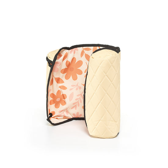 Beige BoostedSafe reversible cover standing upright with floral kid-friendly print visible inside