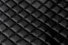 Close-up texture of the black quilted leather-style BoostedSafe booster seat cover.