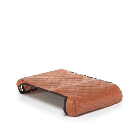 Brown reversible BoostedSafe cover showing quilted exterior and floral print underside.