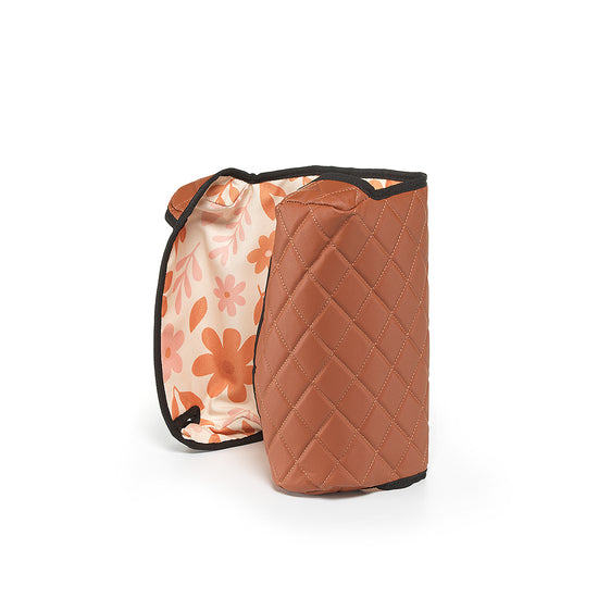 Brown BoostedSafe reversible cover standing upright with floral kid-friendly print visible inside.