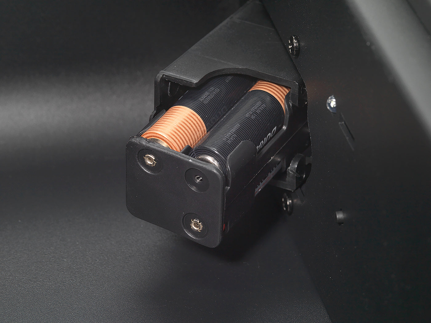 Close-up of BoostedSafe Elite battery tray holding AA batteries for the electronic lock.