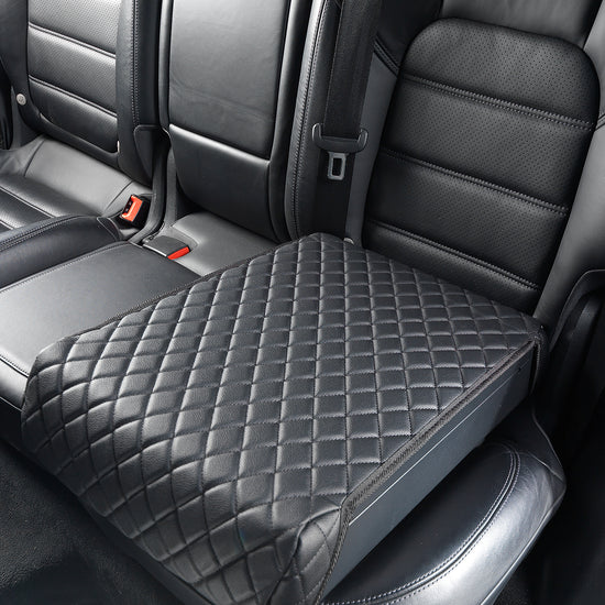 BoostedSafe Elite closed under quilted cover on a rear vehicle seat.