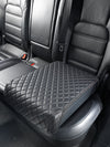 BoostedSafe Elite closed under quilted cover on a rear vehicle seat.