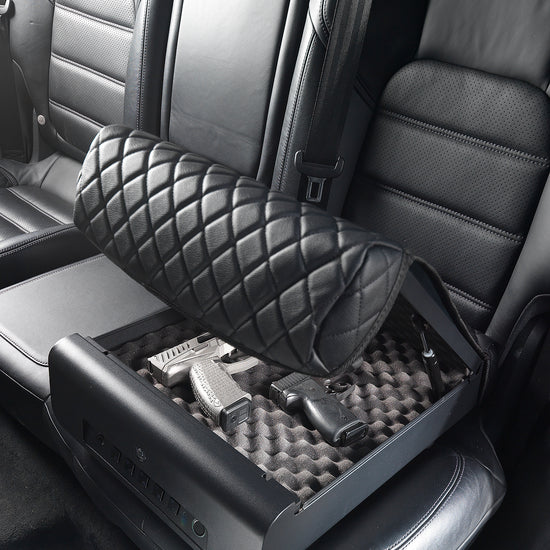 BoostedSafe Elite partially closing over two handguns in the foam-lined interior.