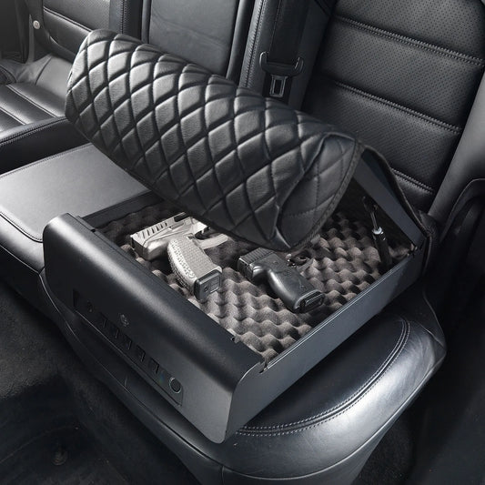 Open refurbished BoostedSafe Elite biometric vehicle safe storing two handguns inside a foam-lined rear seat compartment.