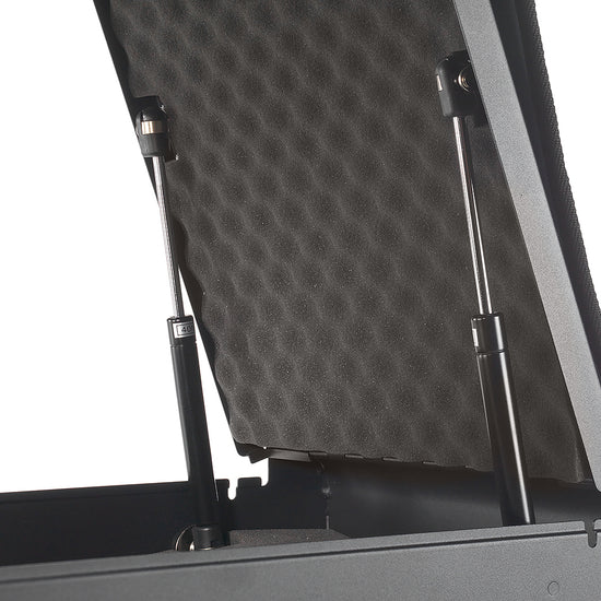 Interior close-up of BoostedSafe Elite dual gas struts supporting the padded lid.
