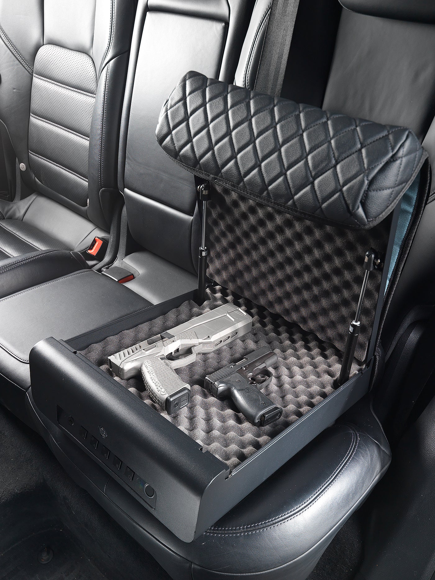 BoostedSafe Elite open on rear vehicle seat storing two handguns on protective foam.