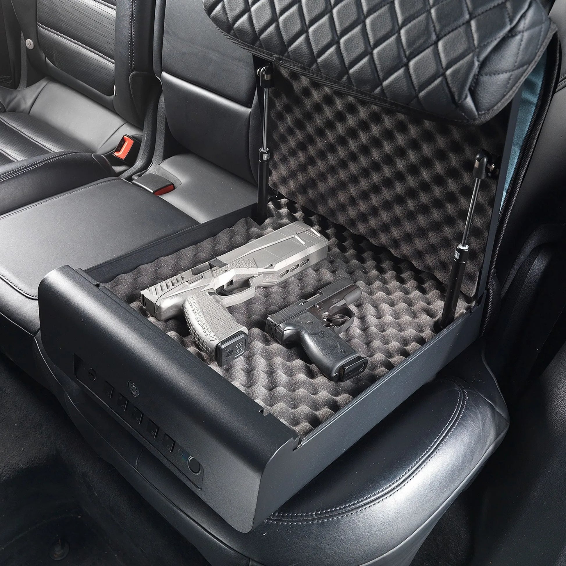 BoostedSafe Elite open vehicle safe with padded foam interior storing two handguns securely.