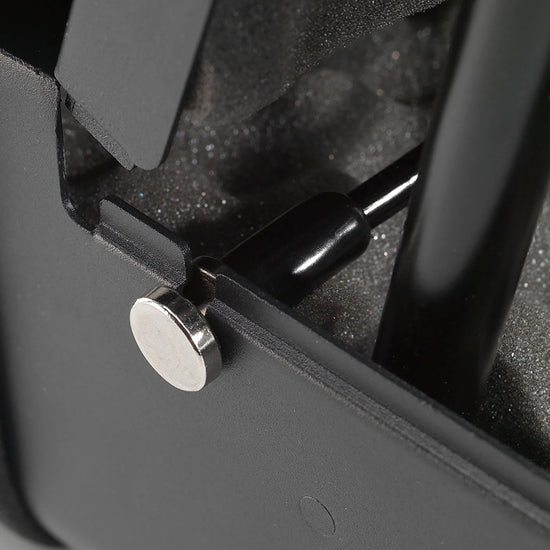 Boosted Safe Elite hidden safe close-up of gas strut mounting hardware and reinforced steel hinge system.