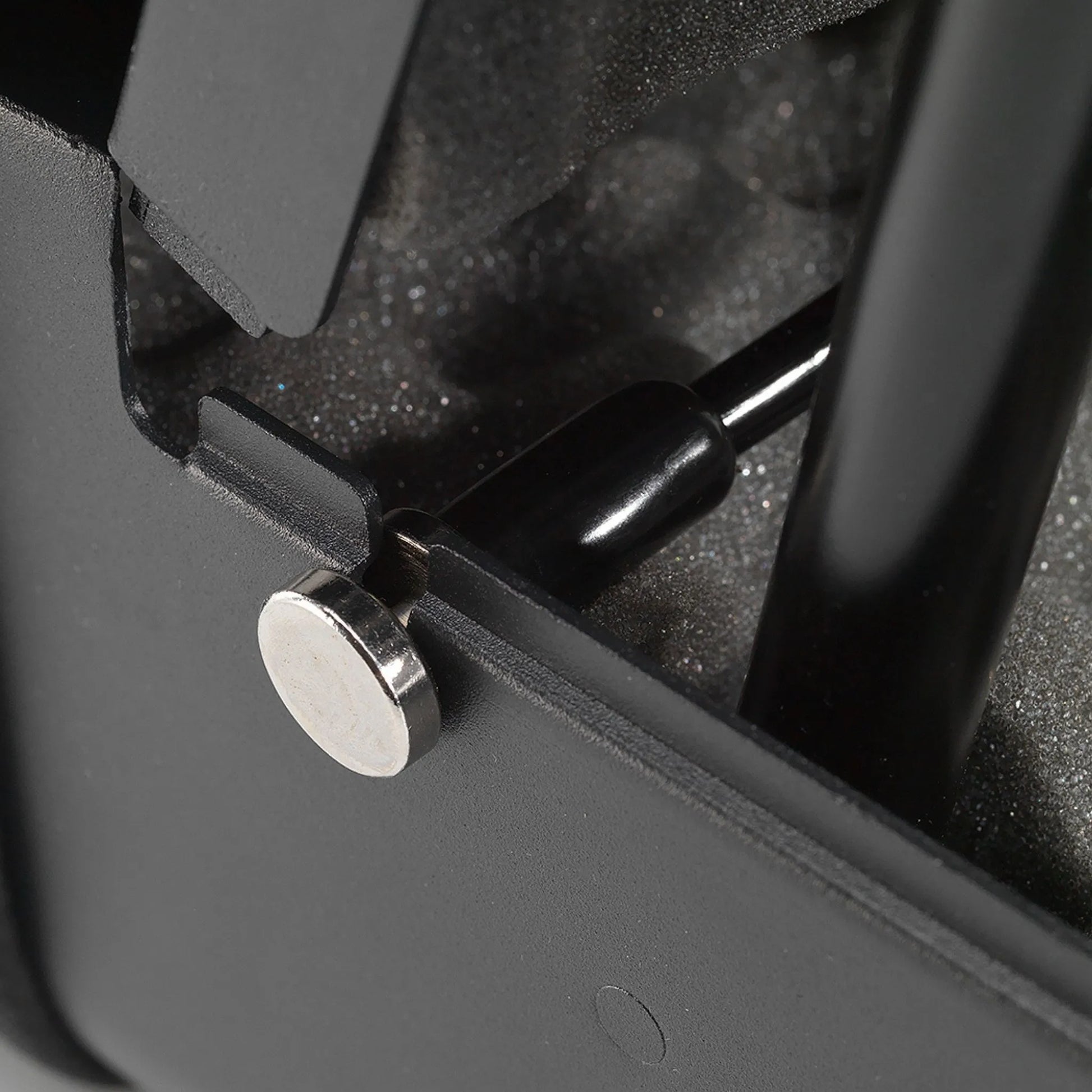 Boosted Safe Elite hidden safe close-up of gas strut mounting hardware and reinforced steel hinge system.