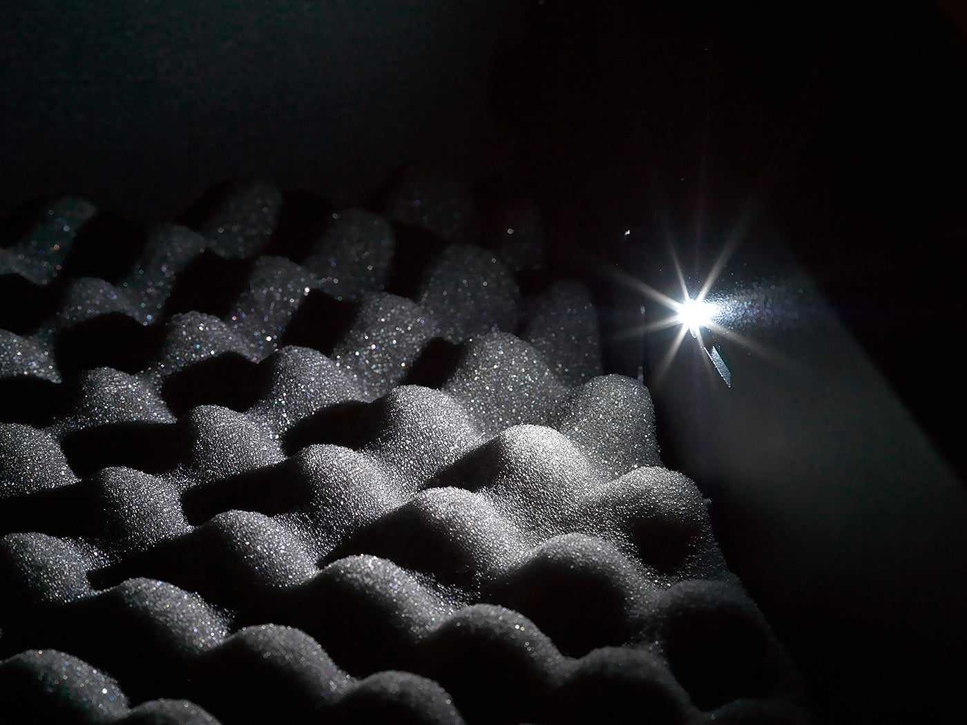 Close-up of BoostedSafe Elite interior LED lighting over protective foam padding.