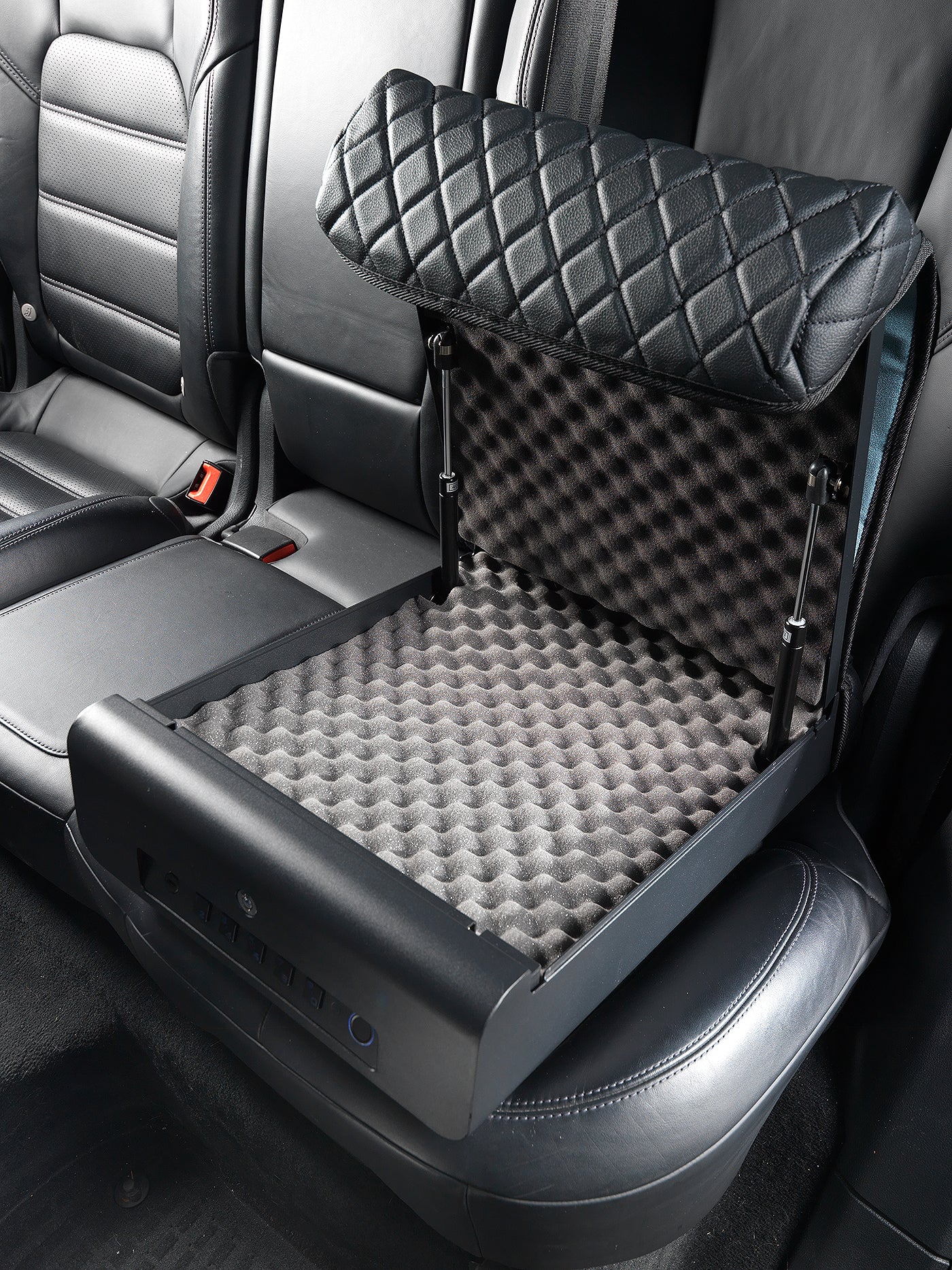 Open BoostedSafe Elite on a rear vehicle seat showing empty foam-lined interior.
