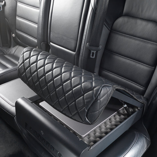 BoostedSafe Elite open on rear vehicle seat with a laptop stored inside.
