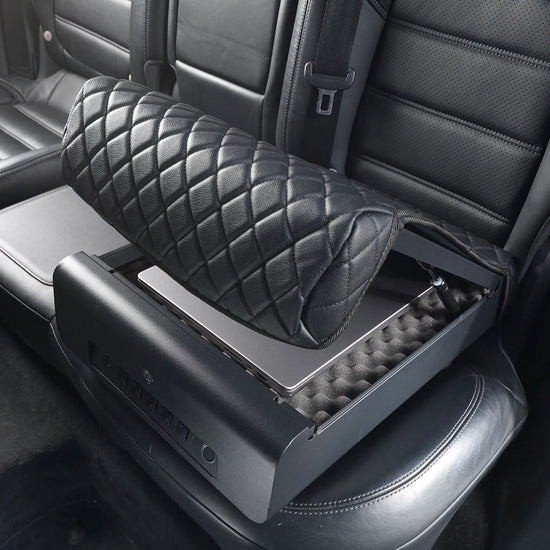 BoostedSafe Elite open on a rear vehicle seat with a laptop stored inside the foam-lined security compartment.