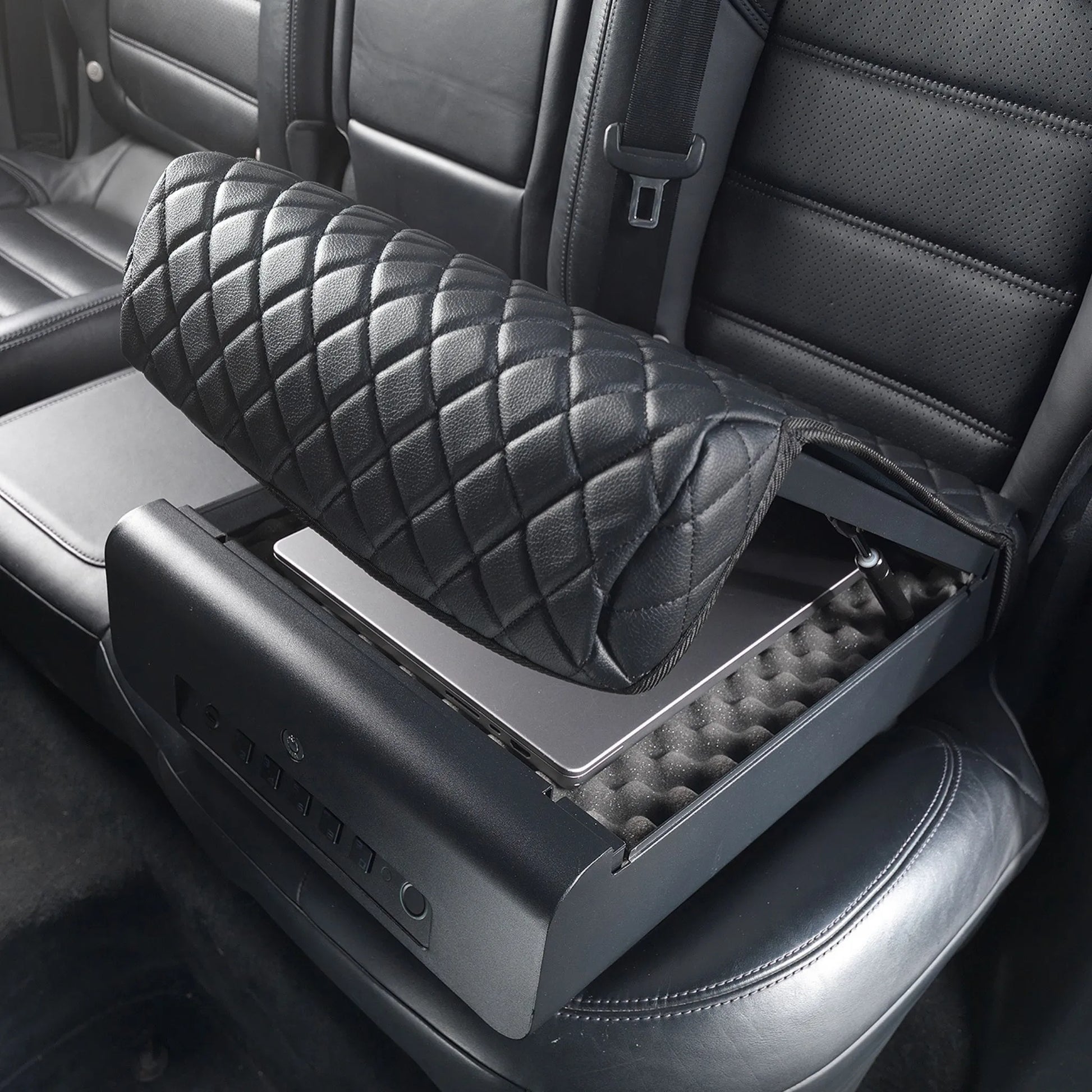 BoostedSafe Elite open on a rear vehicle seat with a laptop stored inside the foam-lined security compartment.