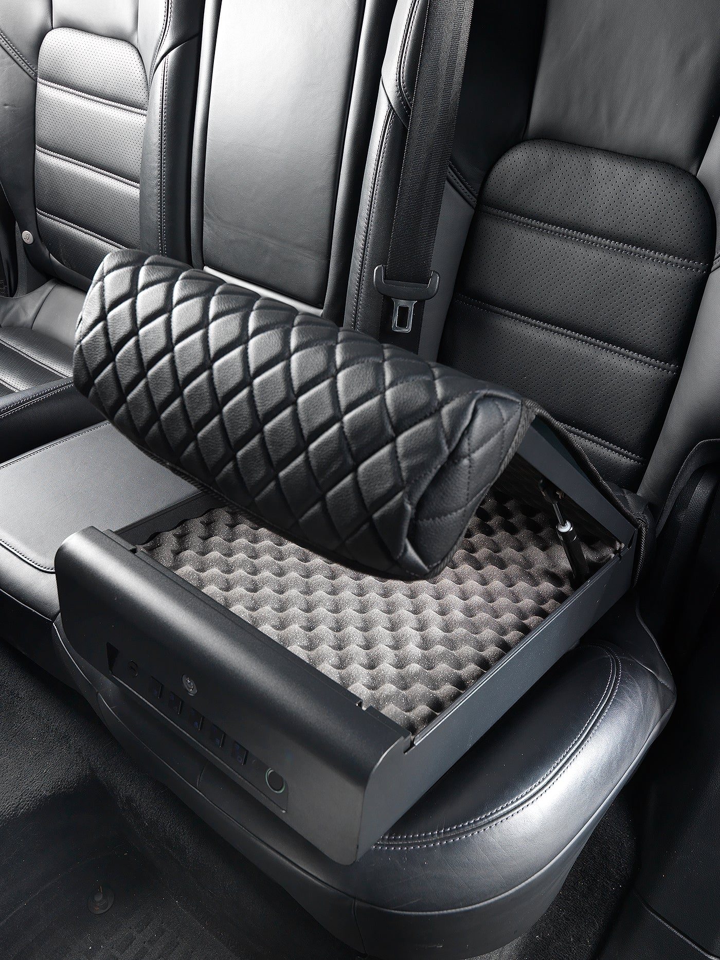 BoostedSafe Elite opening on a rear vehicle seat with interior foam padding visible.
