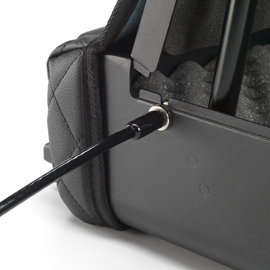 Security cable connected to open BoostedSafe Elite with interior foam and lid hinge visible.