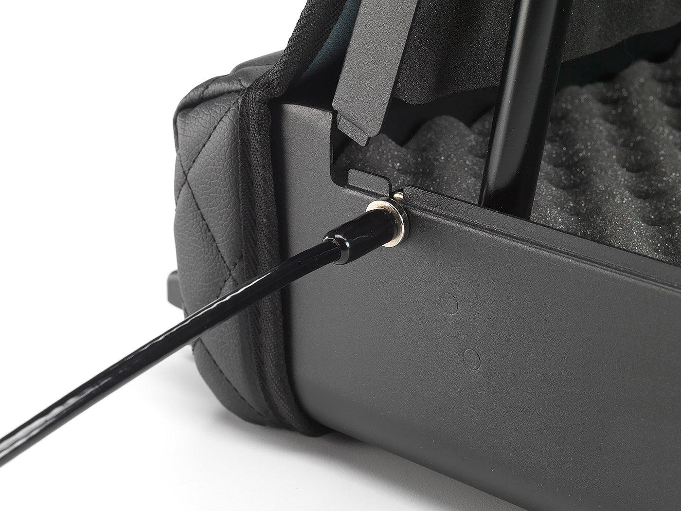 Security cable connected to open BoostedSafe Elite with interior foam and lid hinge visible.