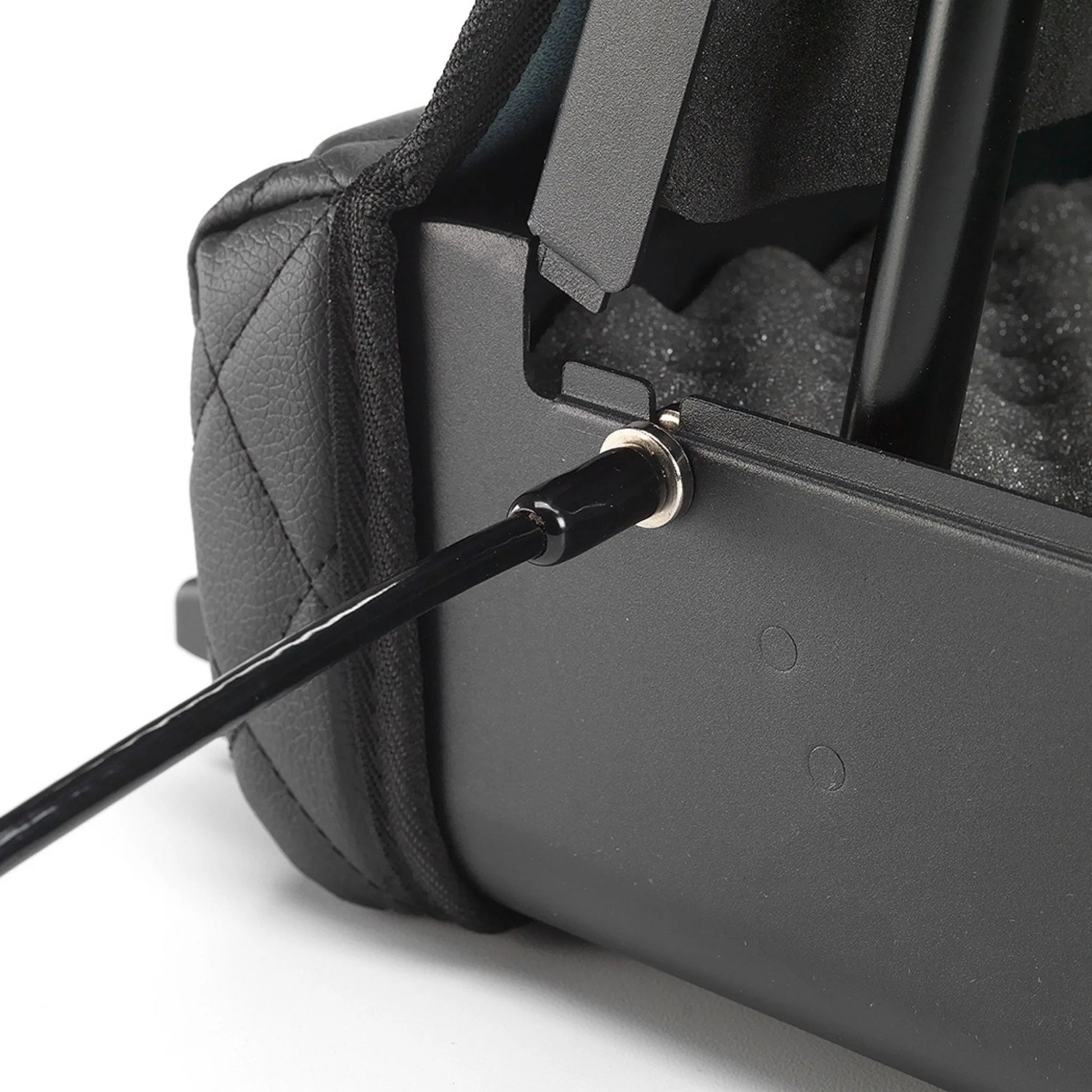 Close-up of the BoostedSafe Elite security cable connected to the side anchor point with the safe opened.