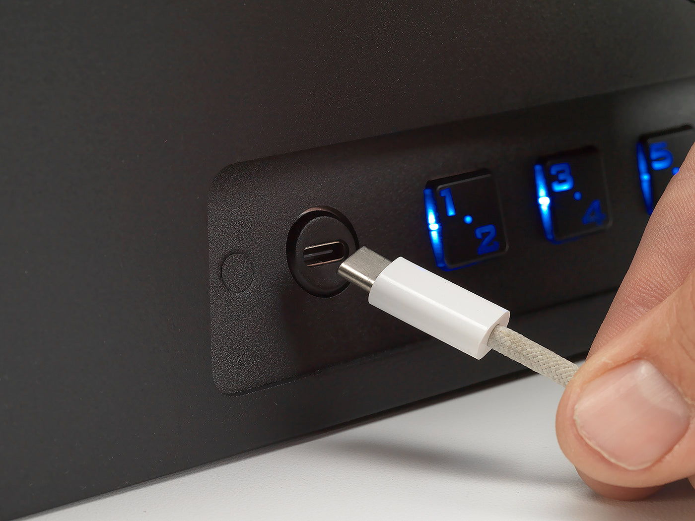 Close-up of BoostedSafe Elite USB-C jump port beside illuminated keypad buttons