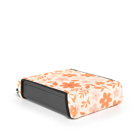 Floral print reversible BoostedSafe cover installed on the safe as a booster seat disguise.