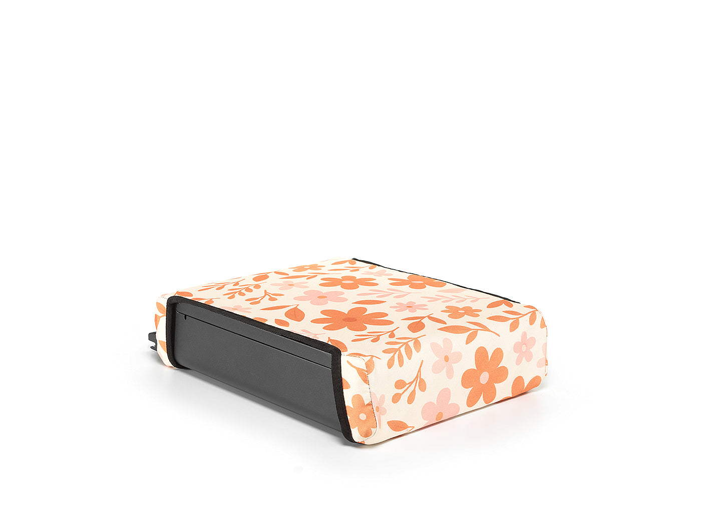 Floral print reversible BoostedSafe cover installed on the safe as a booster seat disguise.