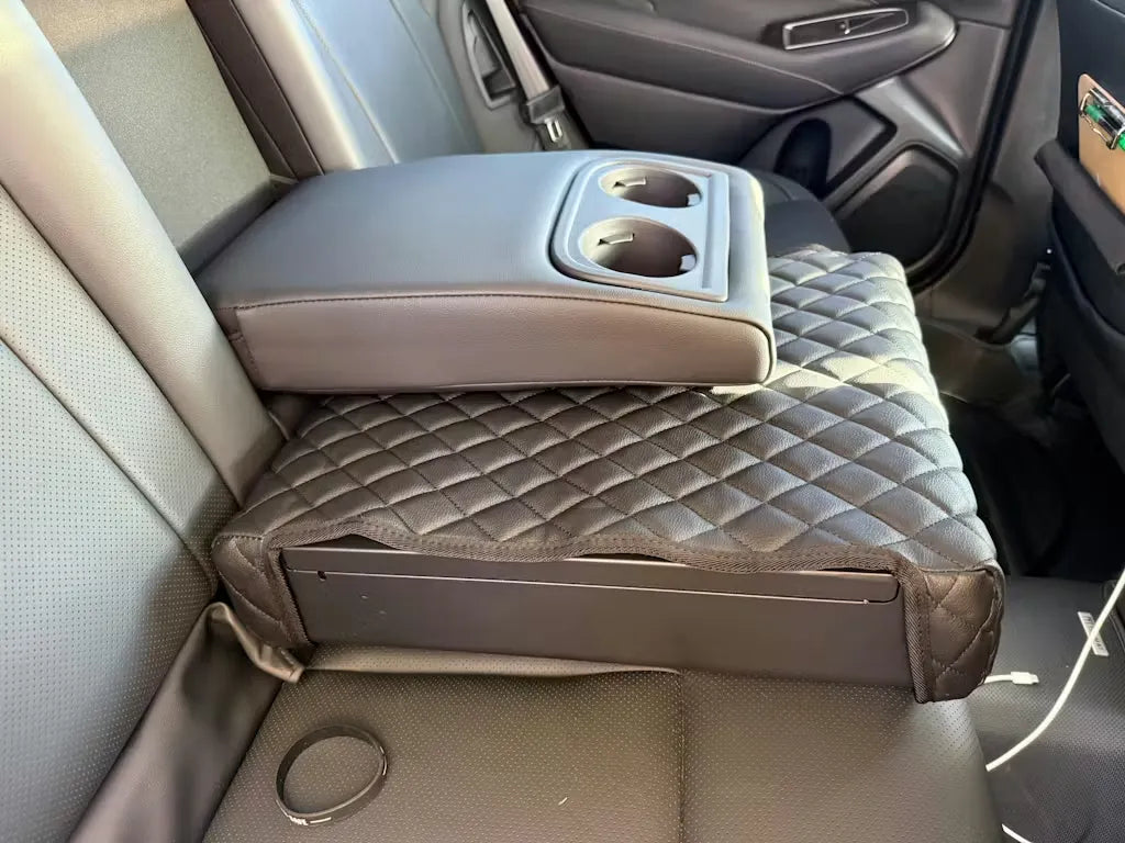 BoostedSafe hidden safe installed beneath rear fold-down armrest.