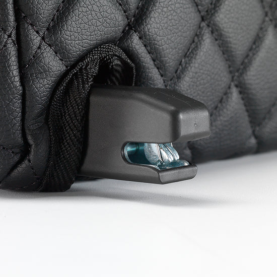 ISOFIX connector close-up protruding through the black quilted BoostedSafe cover.