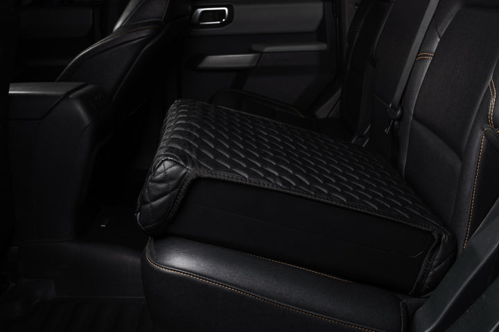 Elite on a truck’s back seat