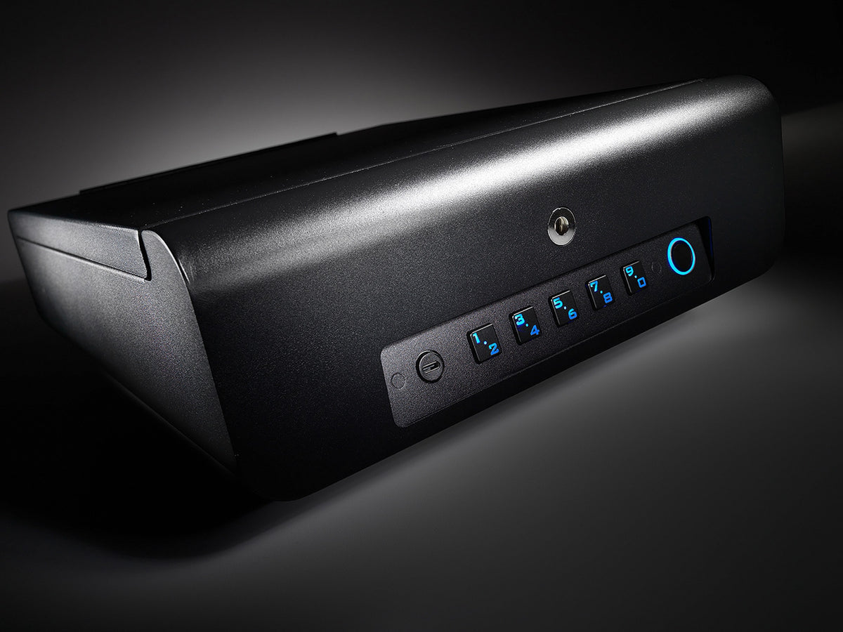 Closed Boosted Safe Elite in low light, its keypad and fingerprint reader glowing blue