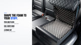 Pick-and-pluck foam insert inside an open Boosted Safe in a car