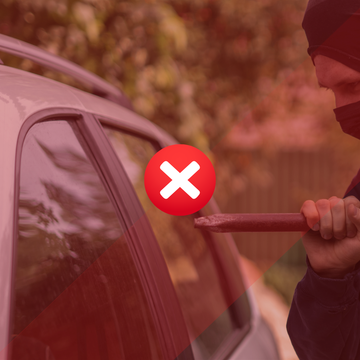 Car break-in risk image showing a masked thief breaking a vehicle window.
